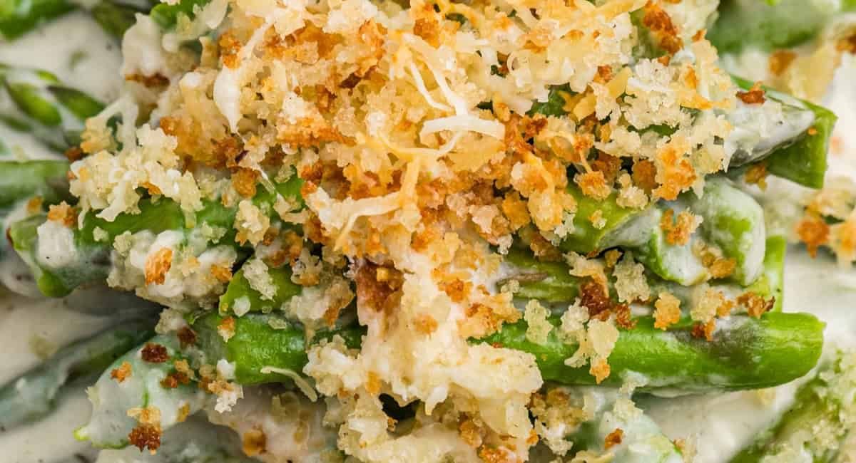 Up close image of asparagus casserole with garnish.