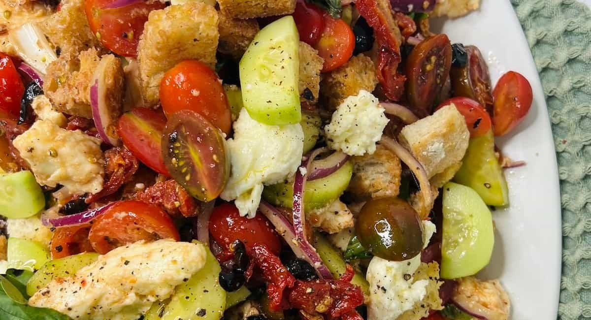 Overhead image of panzanella toscana with fresh mozzarella caprese.