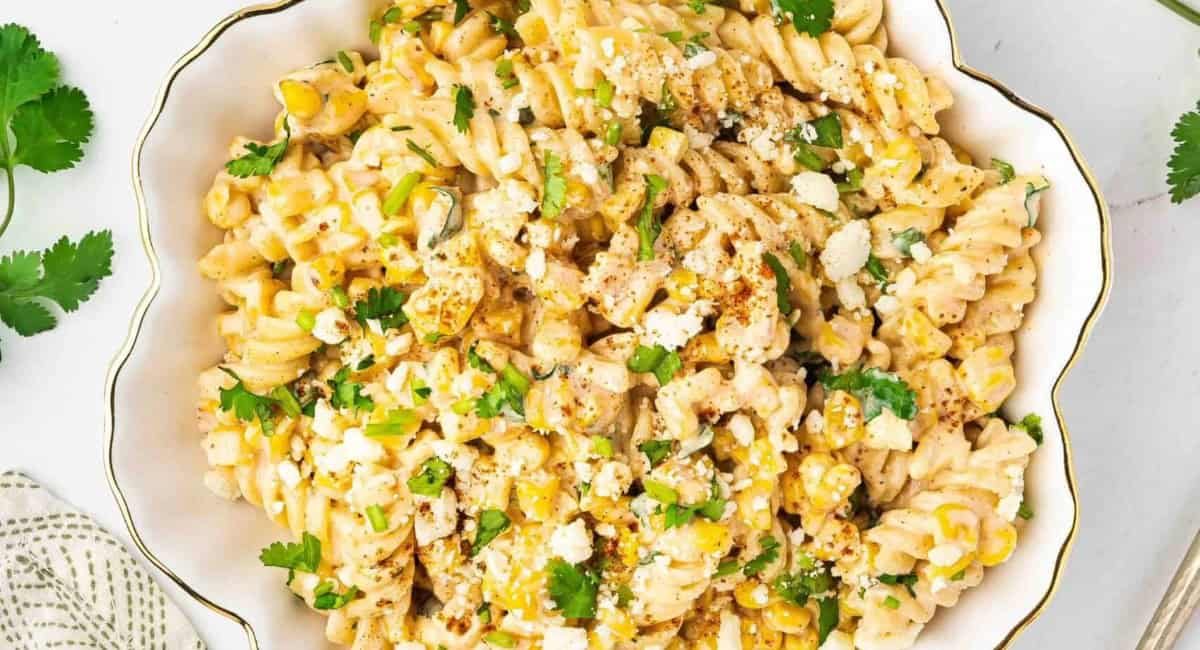 Overhead image of Mexican street corn pasta salad with garnish.