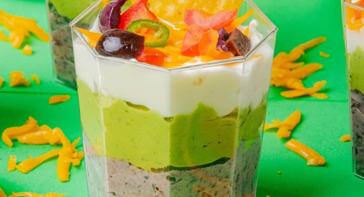 Up close image of Mexican 7 layer dip cups.