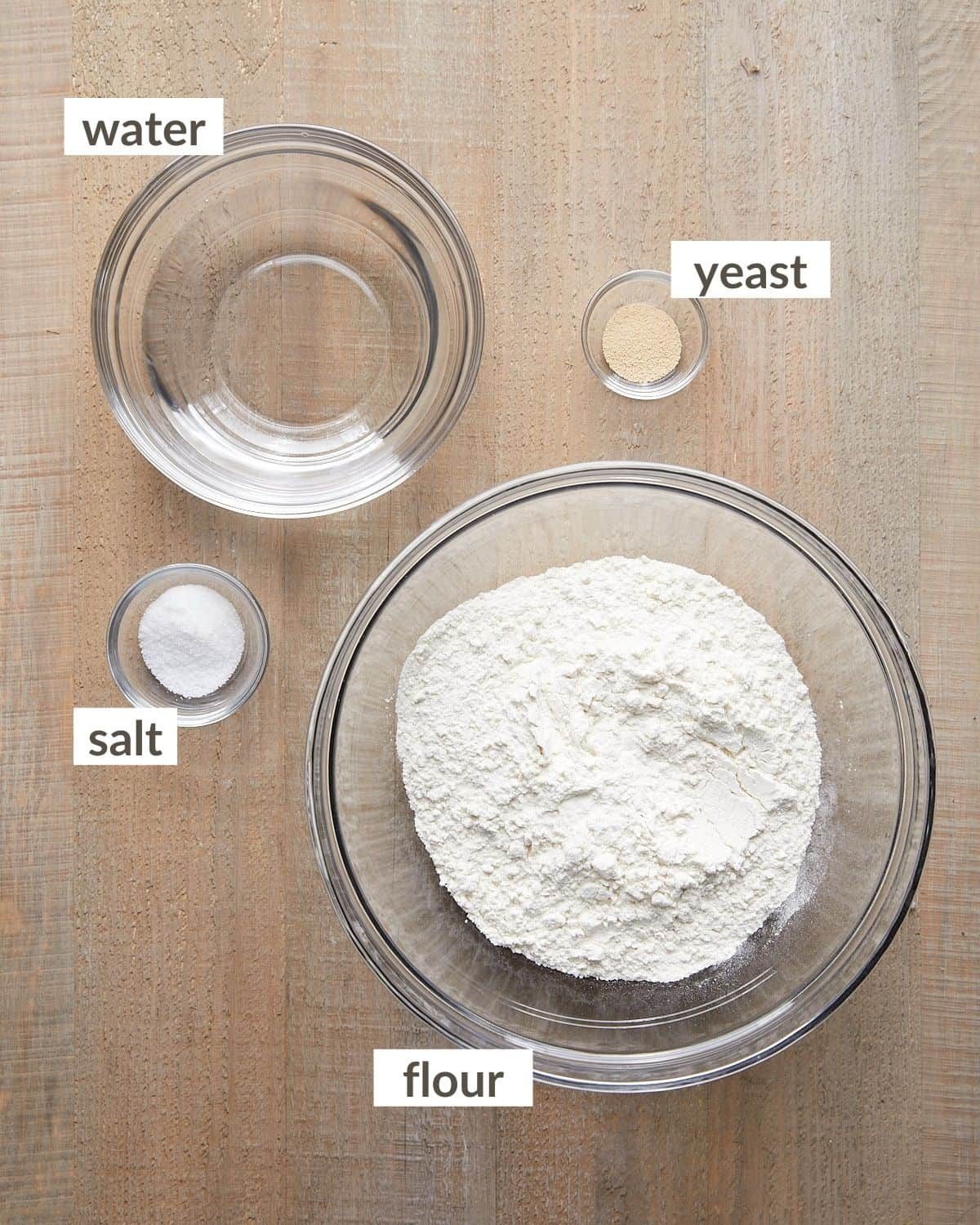 Ingredients needed to make 72 hour pizza dough in glass bowls.