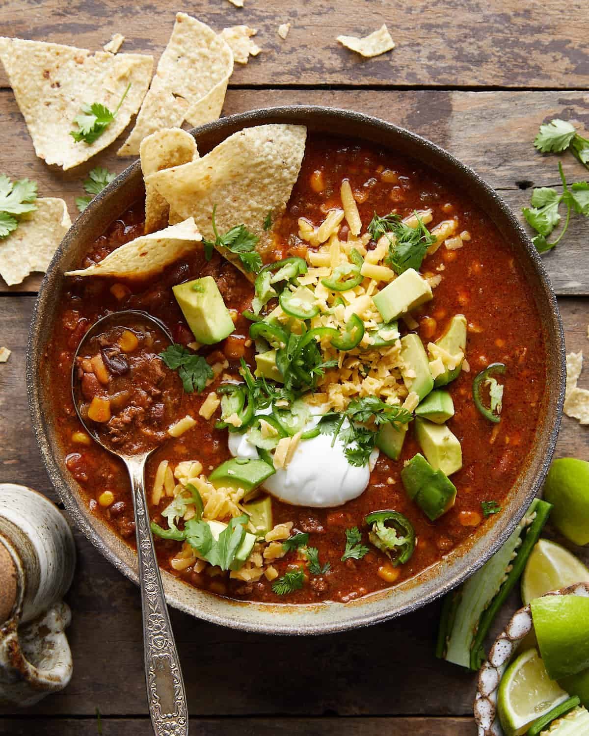 Overhead image of 7 can taco soup with garnish.