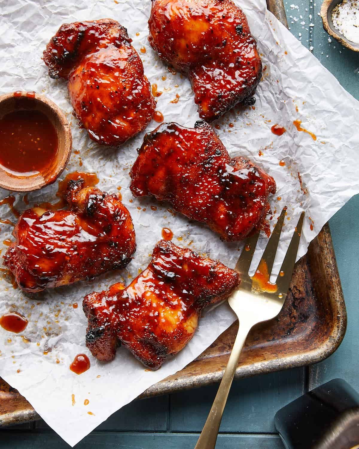 Overhead image of air fryer bbq chicken thighs.