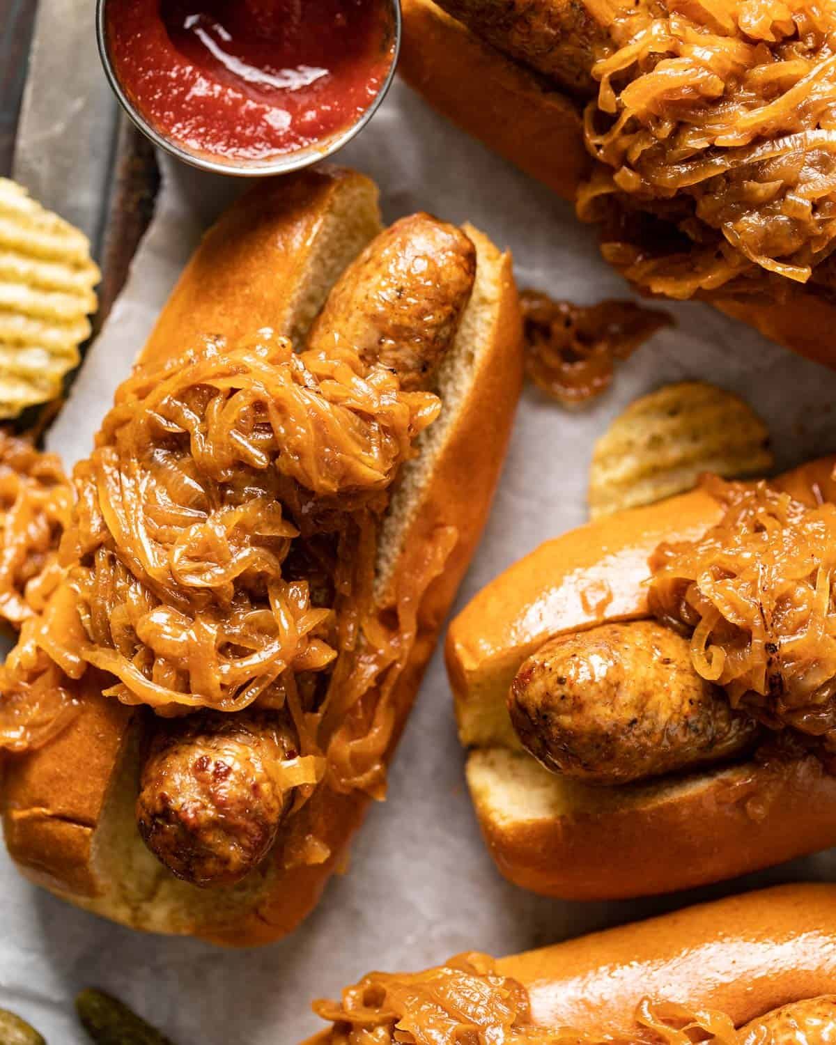 close up of brat on bun with onions