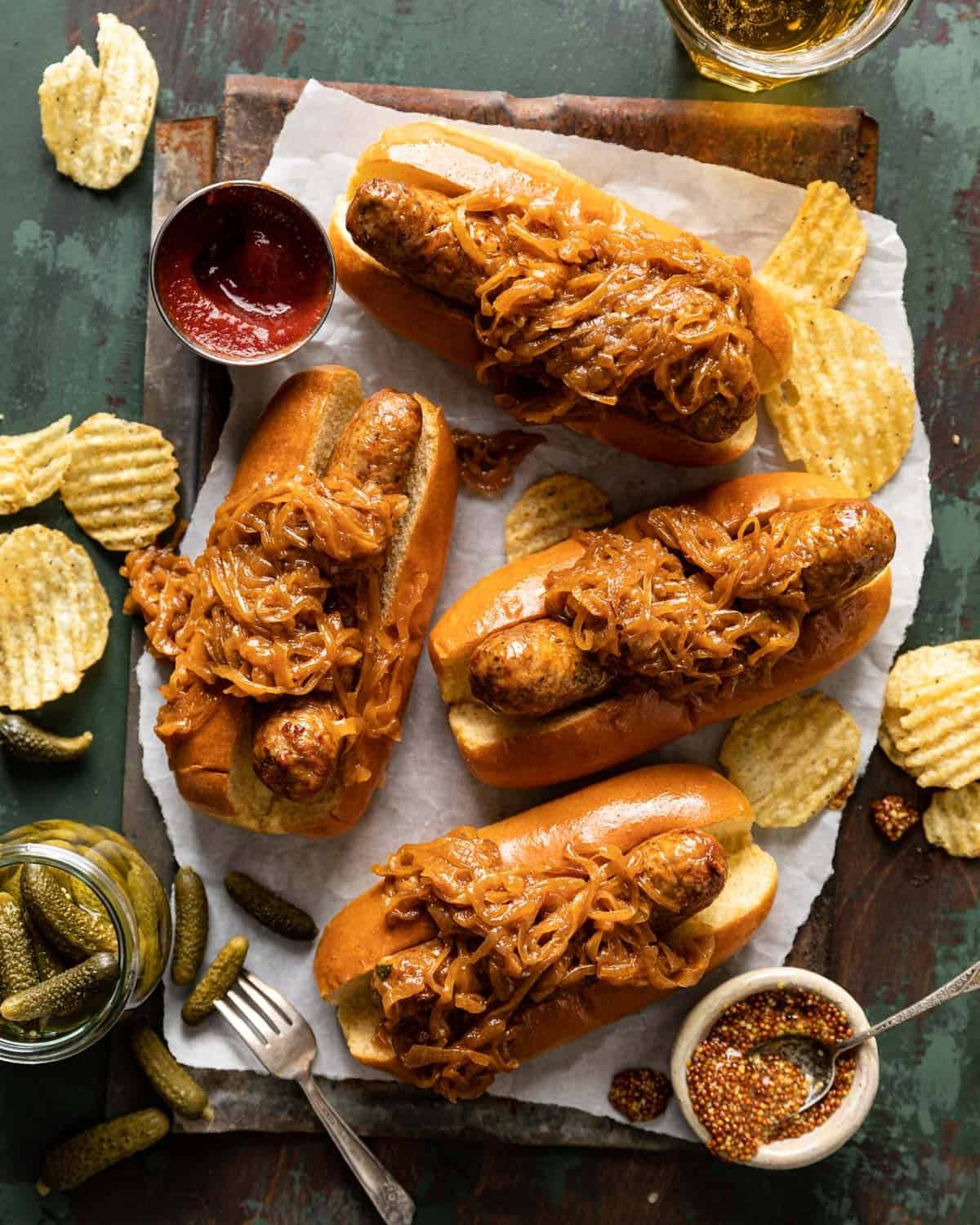 overhead of brats on buns with onions