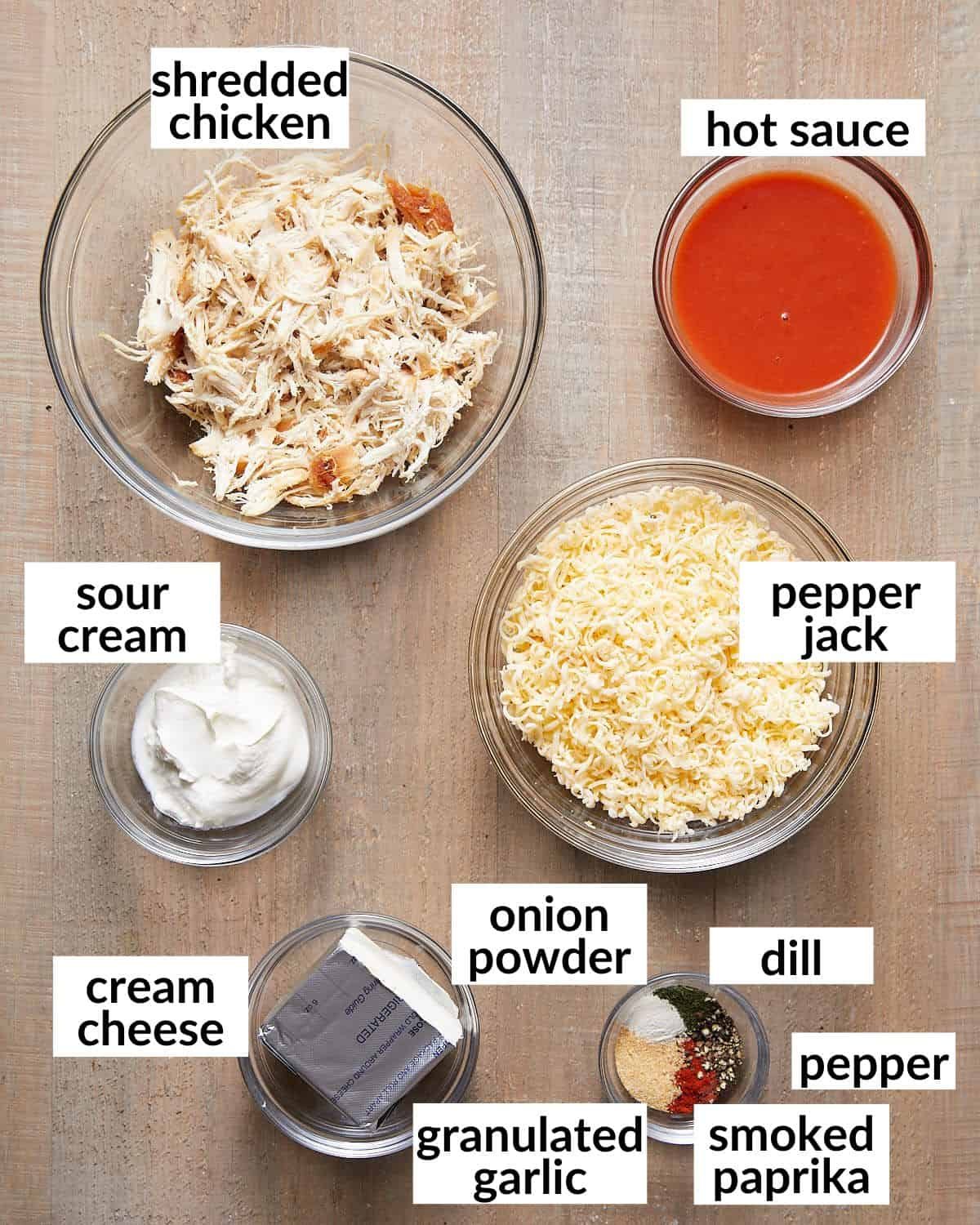 Overhead image of ingredients needed for air fryer buffalo chicken dip.