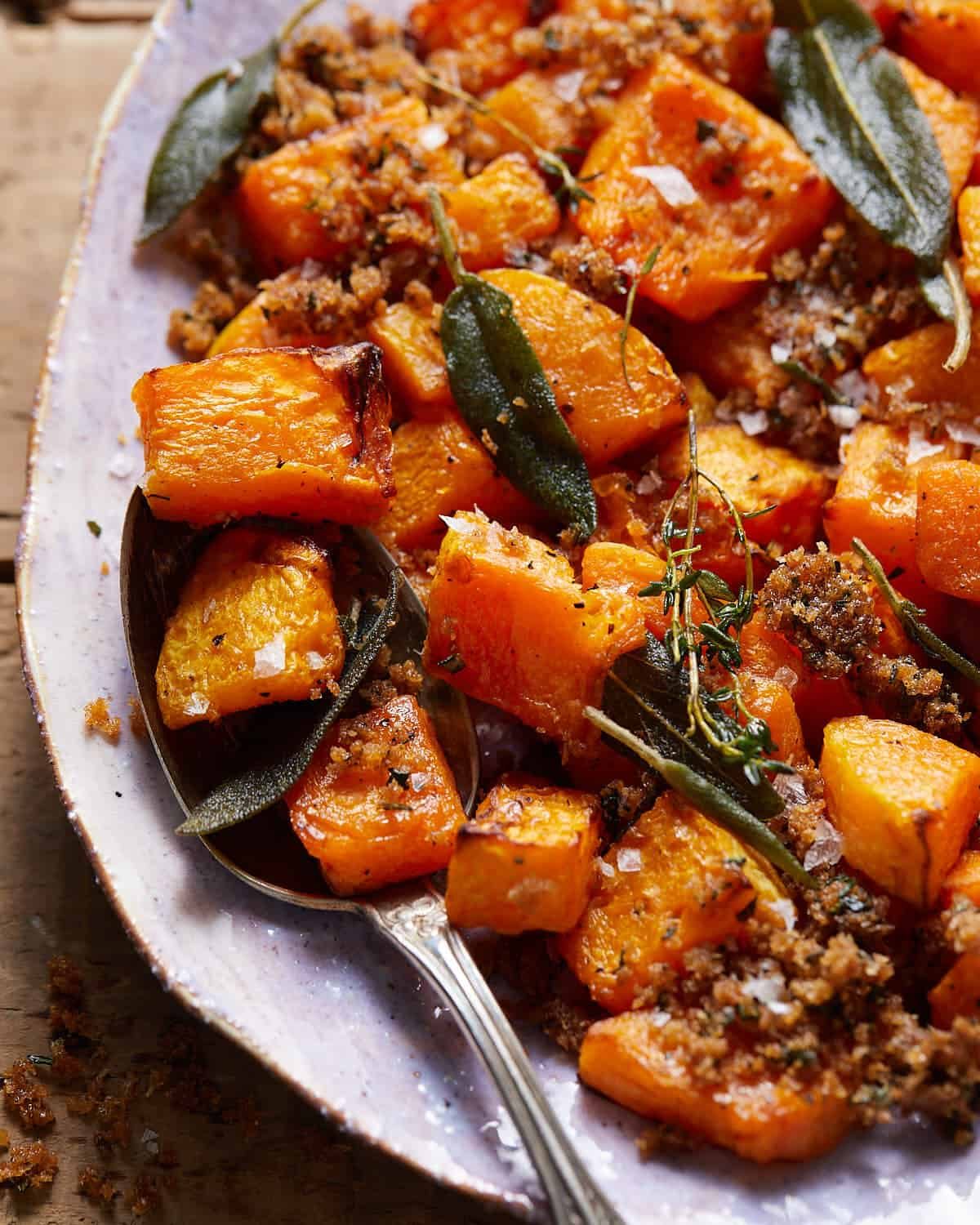 Up close image of air fryer butternut squash on white plate.
