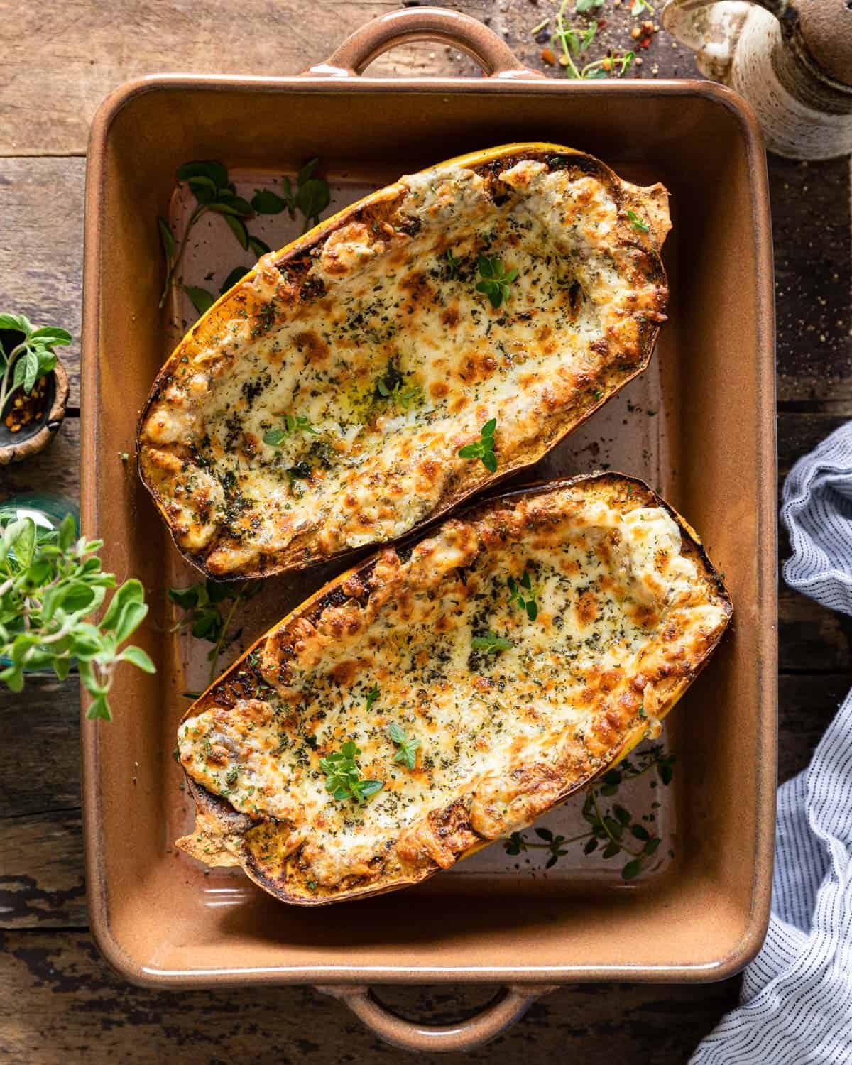Air fried spaghetti squash in a brown casserole dish.