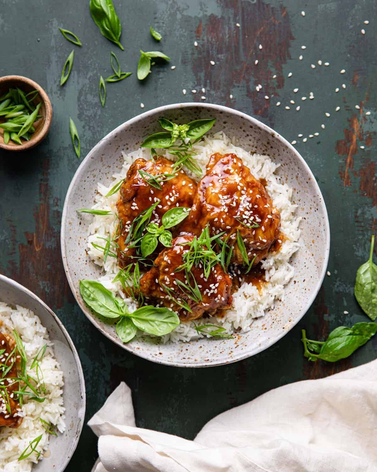 Air fryer teriyaki chicken over a bed or rice.