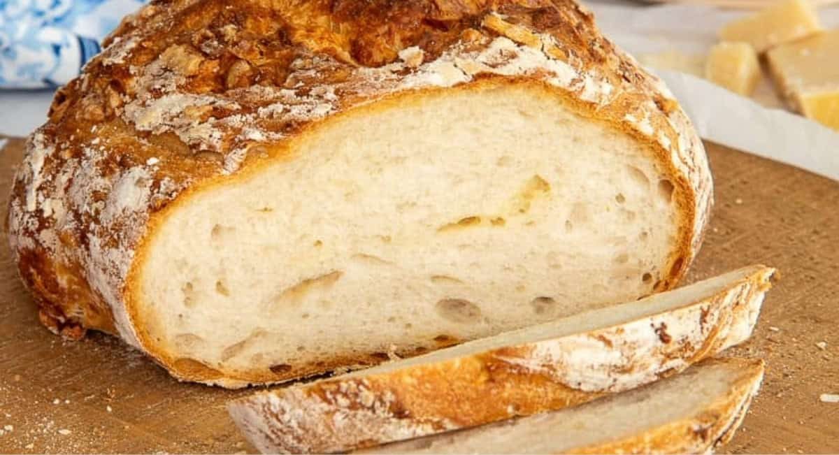 Up close image of asiago sourdough bread sliced.