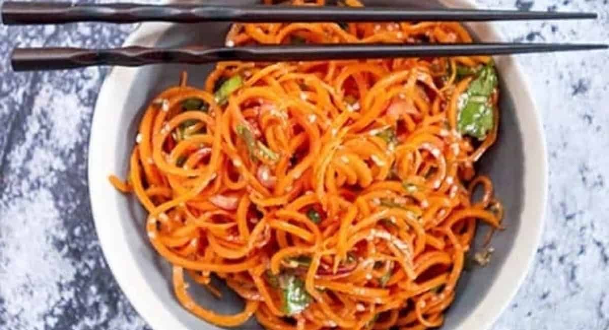 Overhead image of spiraled Asian carrot salad.