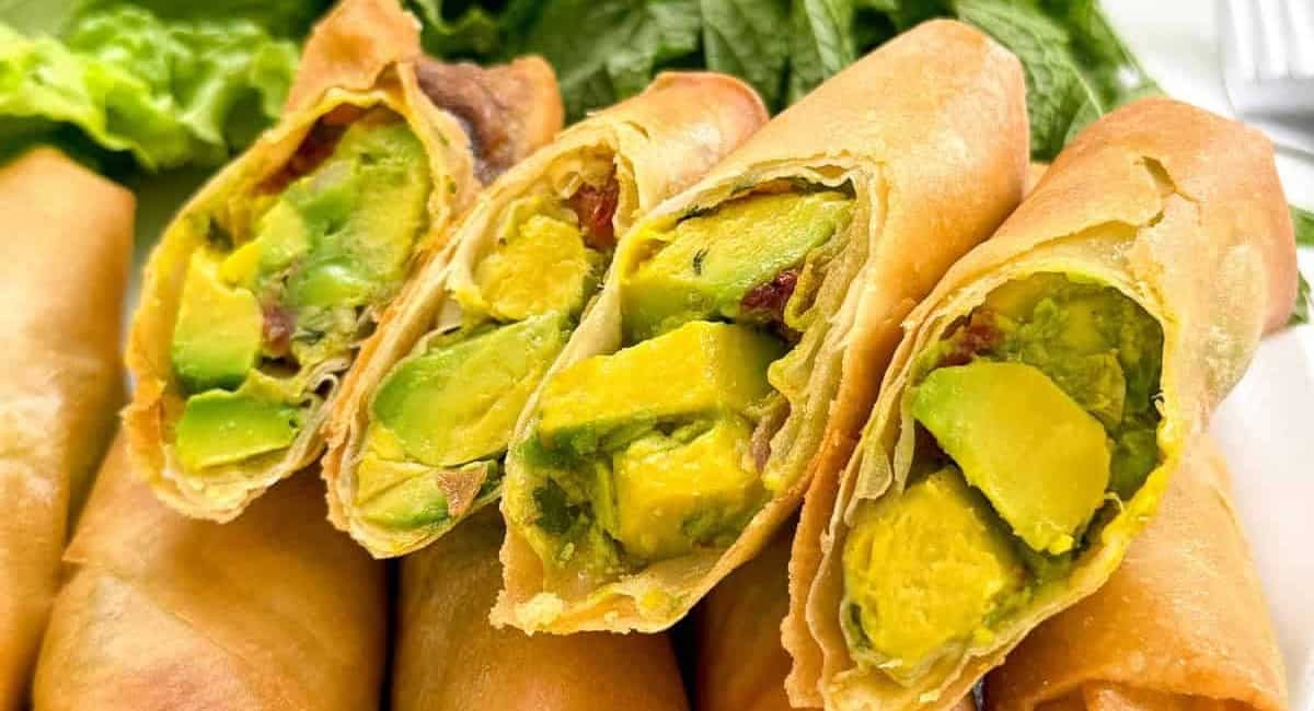 Up close image of avocado egg rolls.