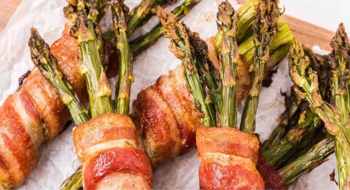 Overhead image of asparagus wrapped in bacon.