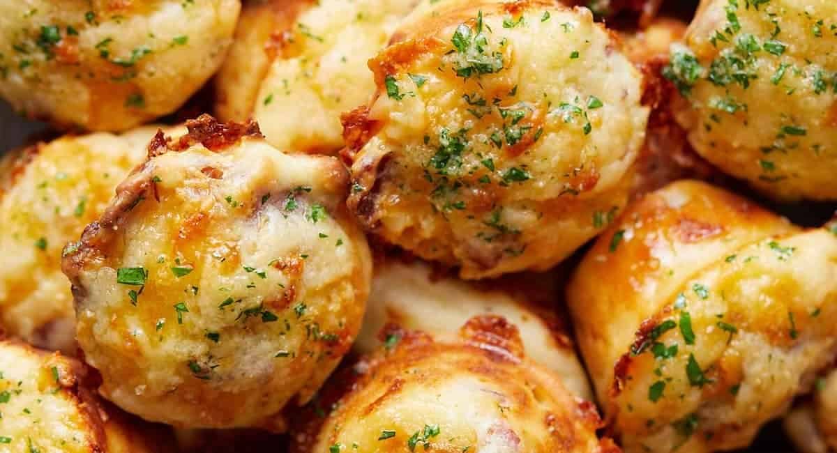 Up close image of bacon and cheddar cheese muffins.