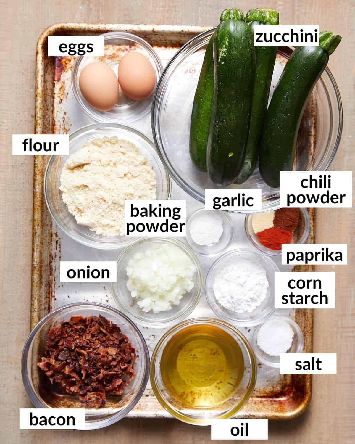 Overhead image of ingredients needed for bacon zucchini fritters.