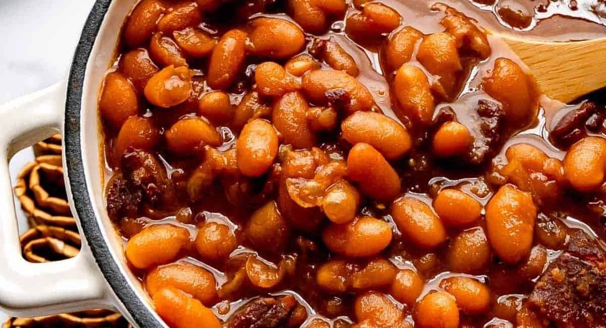 Overhead image of crockpot baked beans with bacon.
