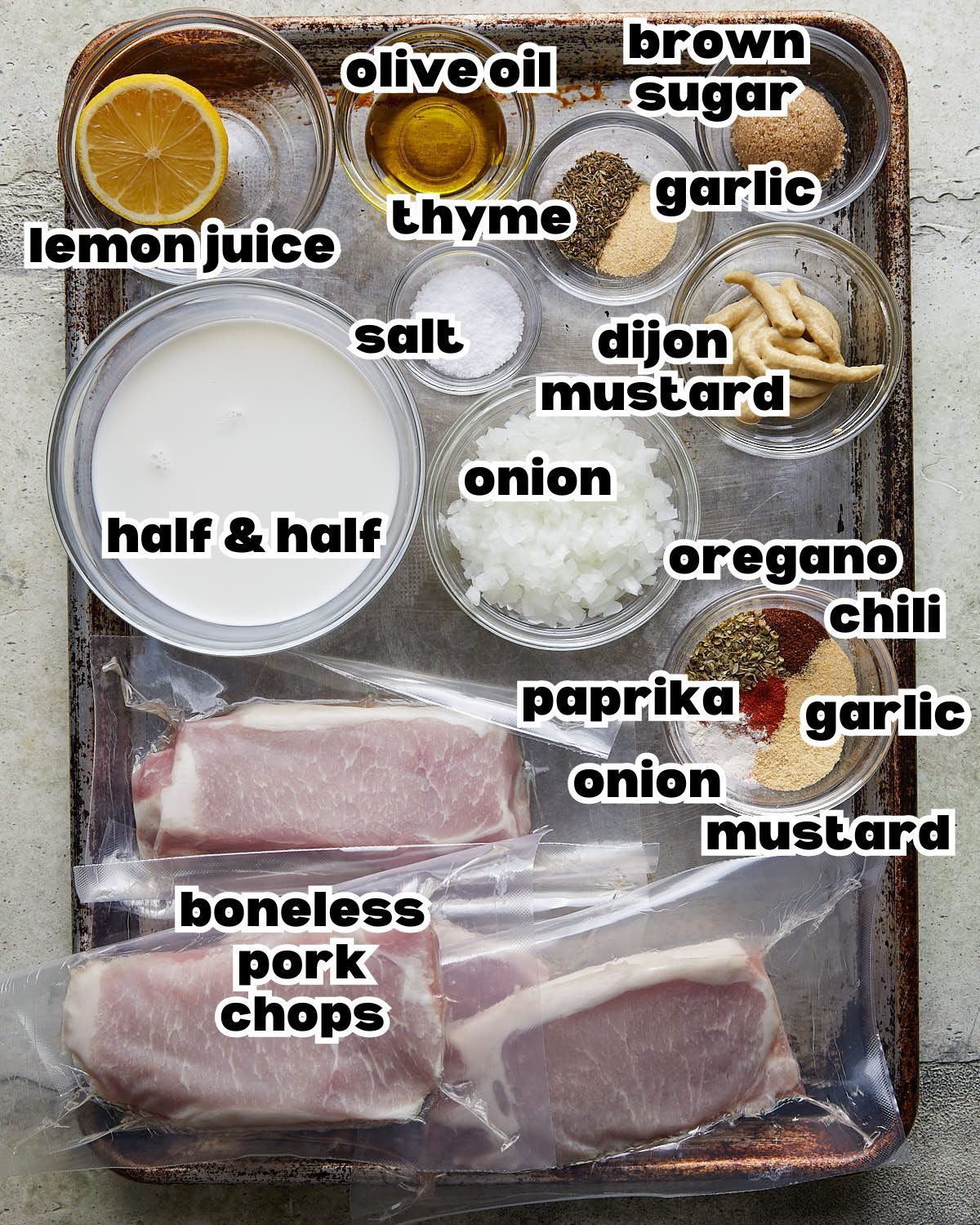 Overhead of ingredients needed to make oven baked boneless pork chops.