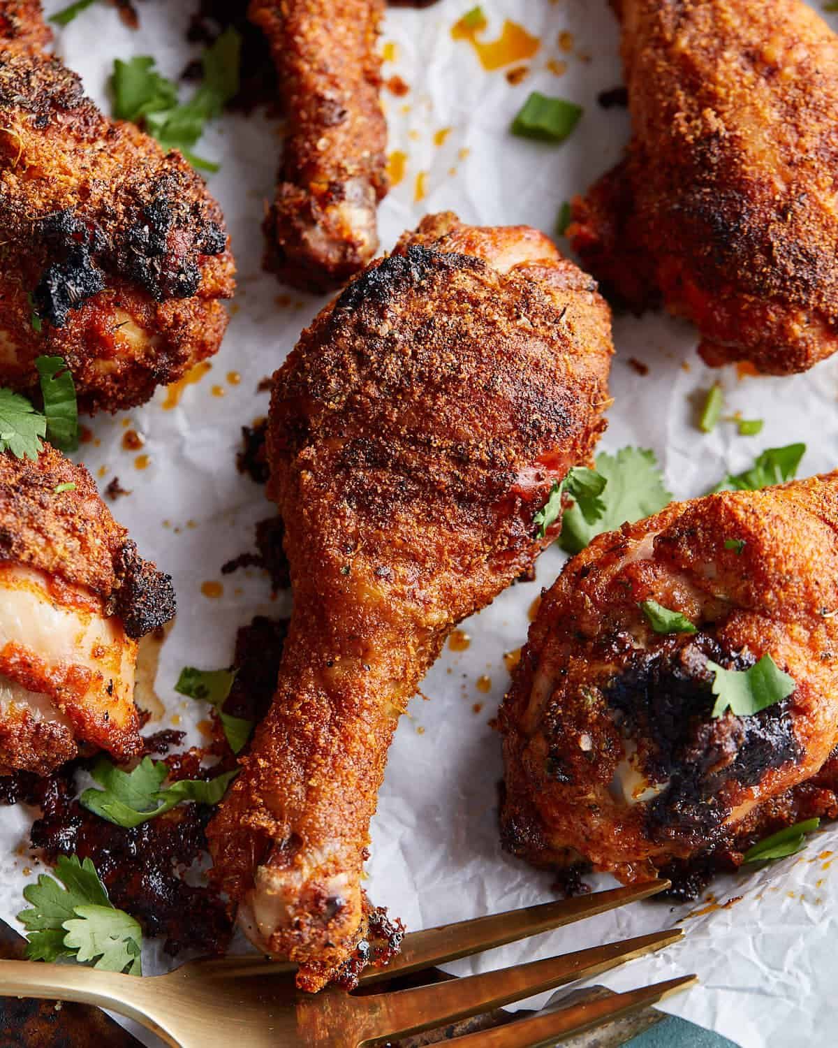Up close image of baked chicken legs.