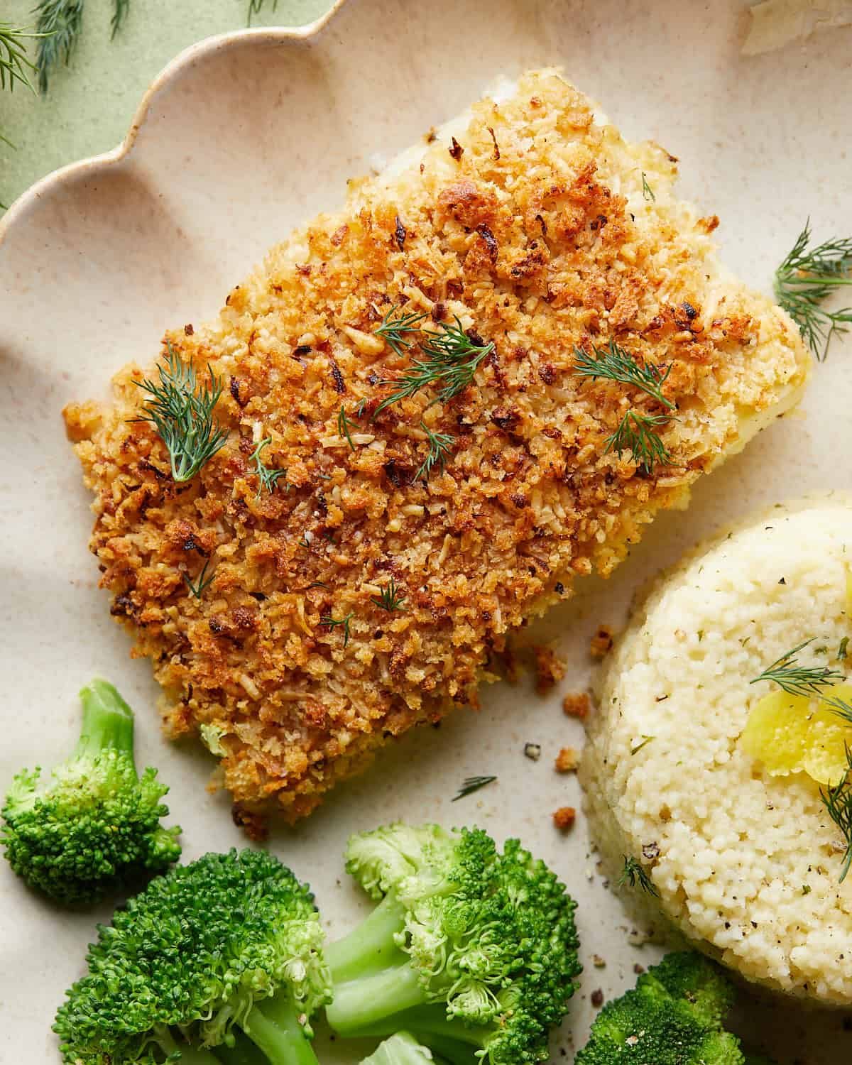 Overhead image of baked halibut with lemon parmesan panko.