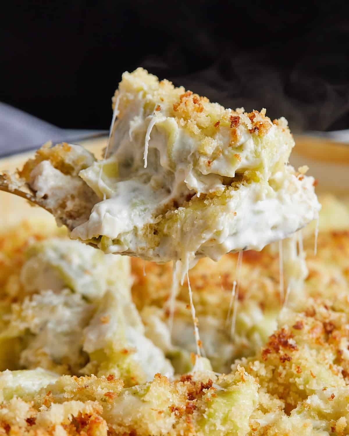 Up close image of baked tortellini alfredo.