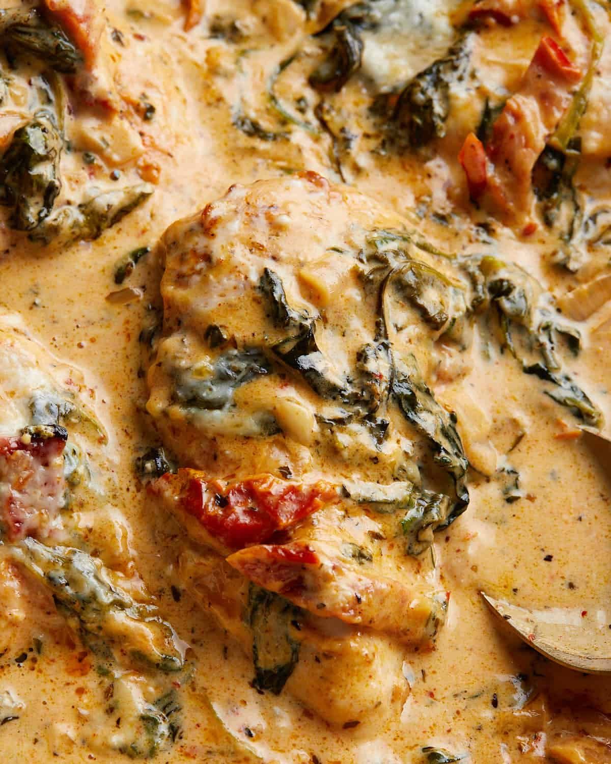 Up close image of baked tuscan chicken.