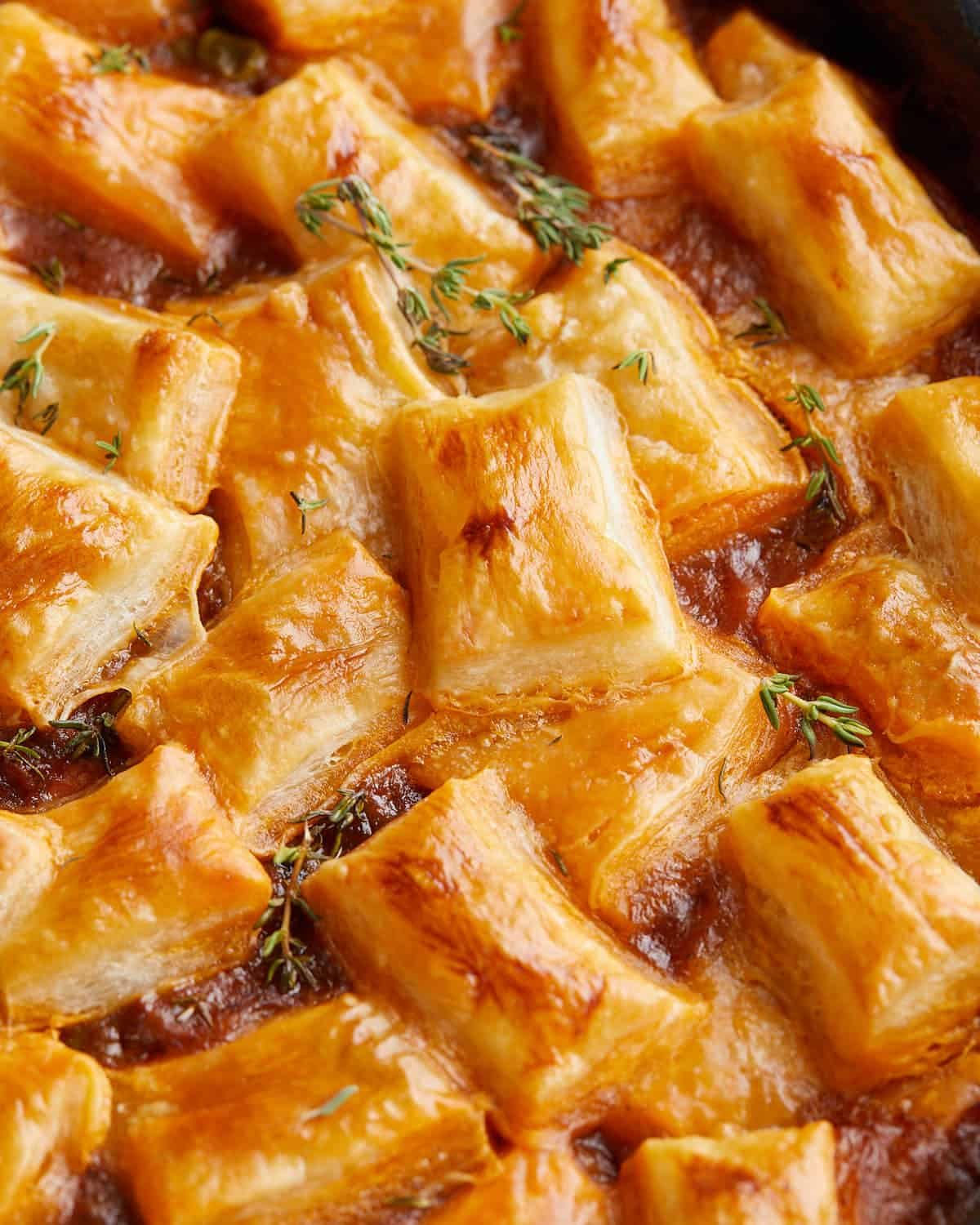 Overhead image of beef pot pie with puff pastry.