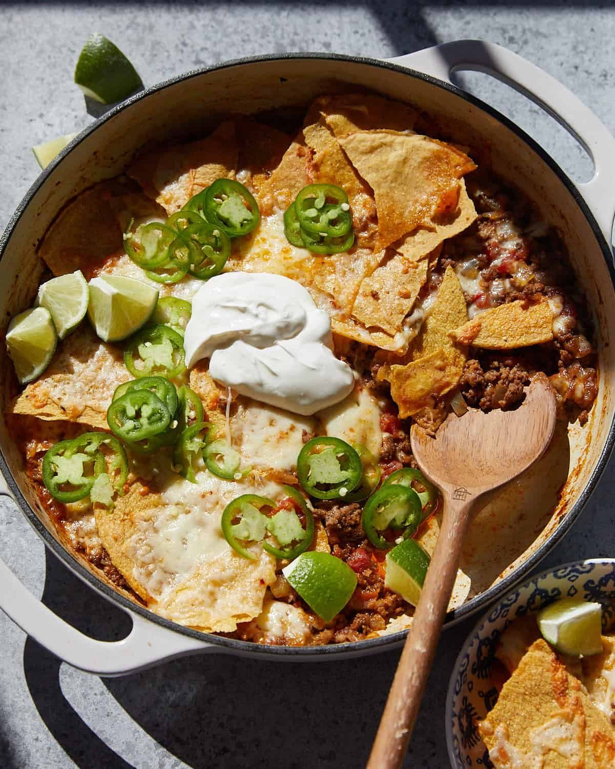 Overhead image of beef taco casserole with garnish.