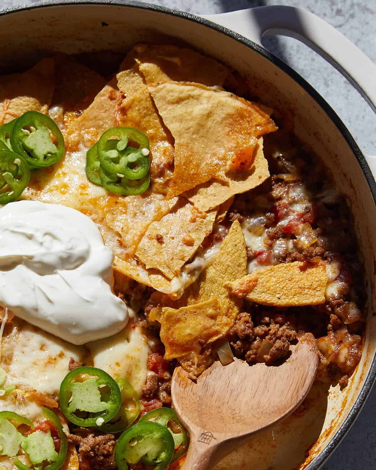 Up close image of beef taco casserole with garnish.