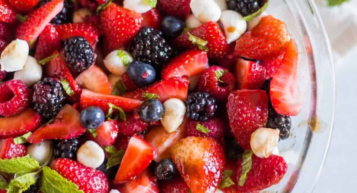 Overhead image of berry caprese sald with strawberry balsamic glaze.
