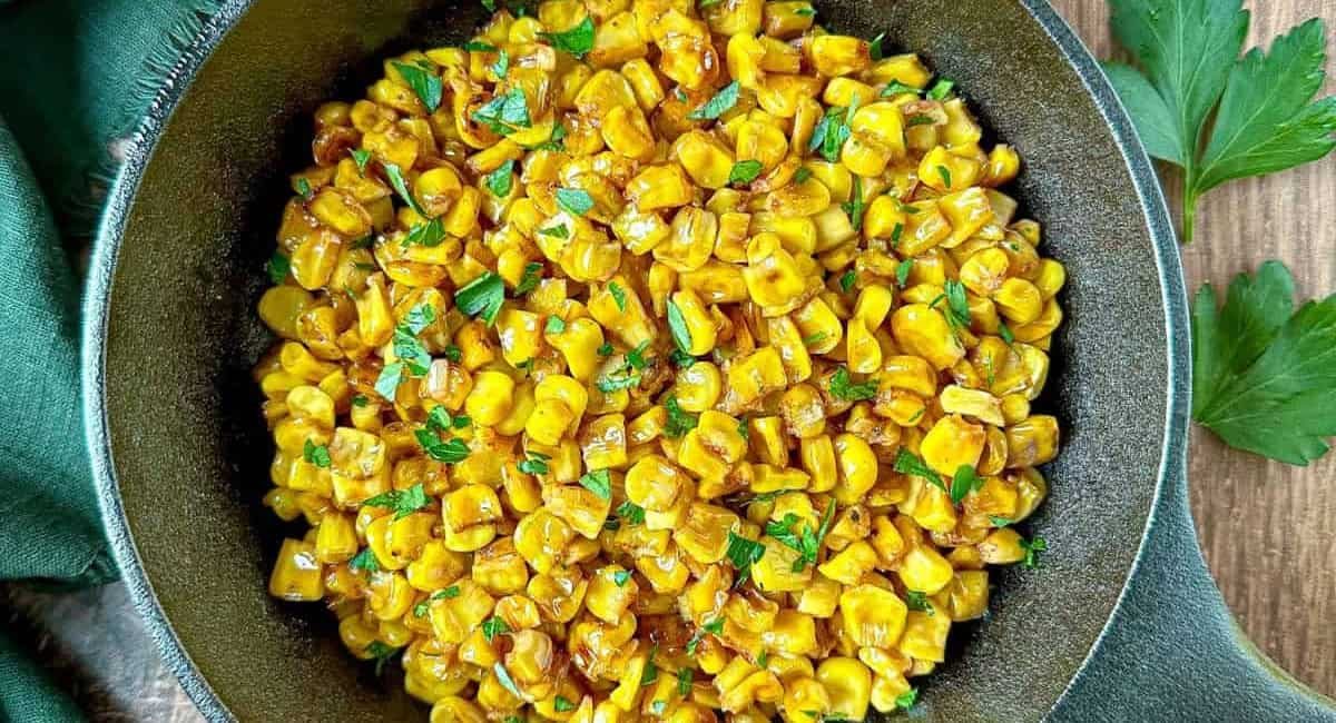 Overhead image of blackened corn in a skillet.