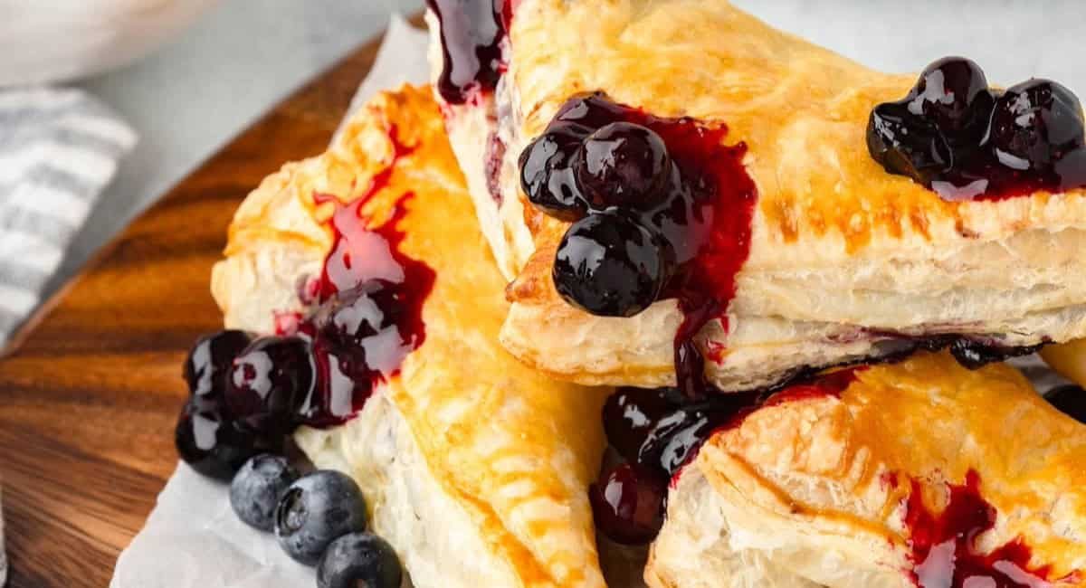 Up close image of blueberry turnovers with puff pastry.