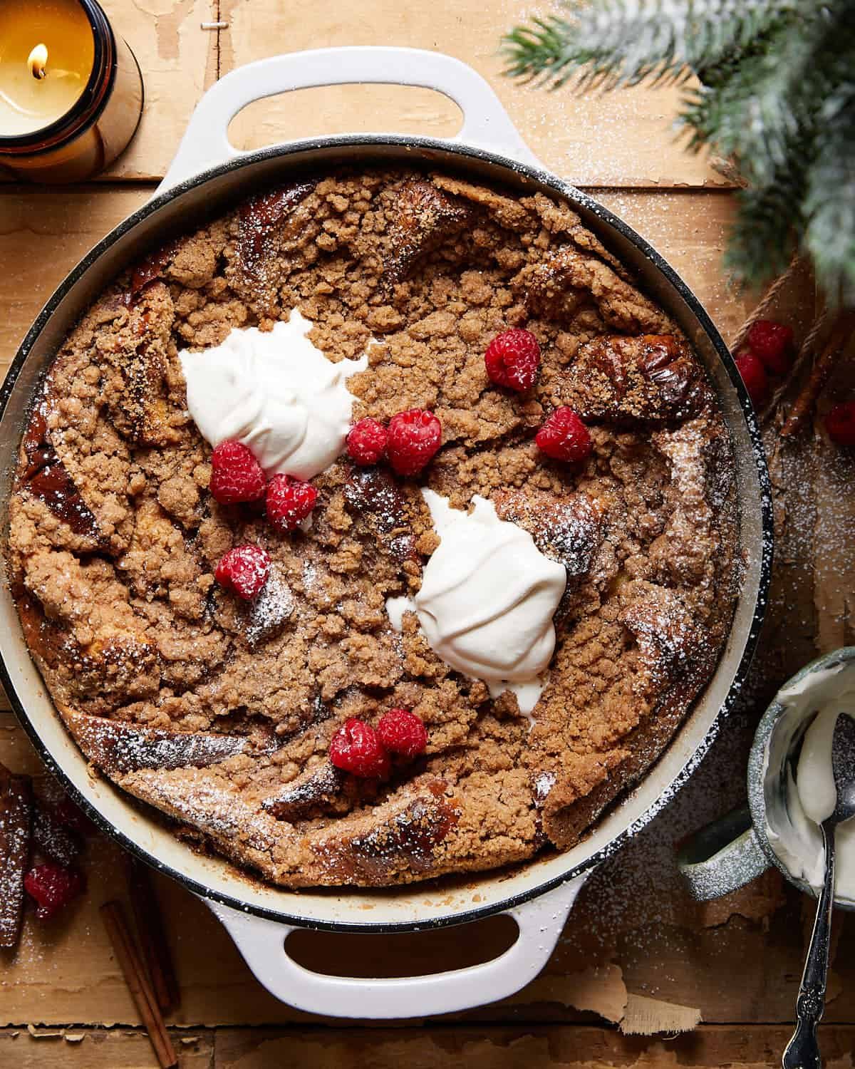 Overhead image of brioche french toast casserole in white pan.