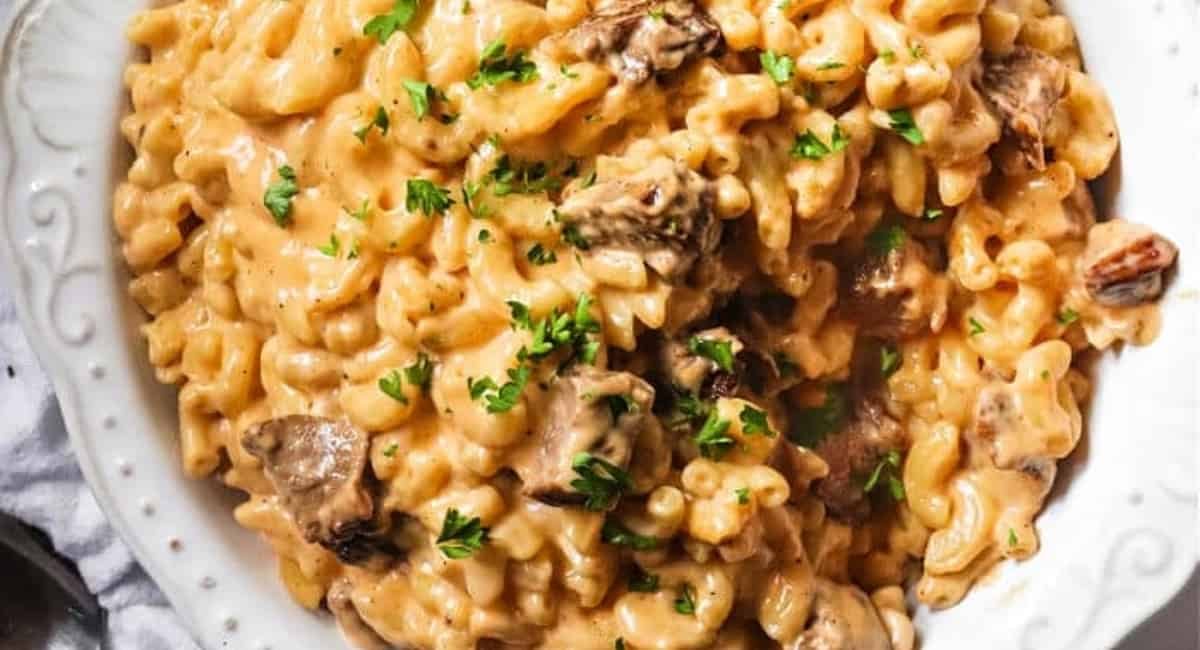 Overhead image of brisket mac and cheese with garnish.
