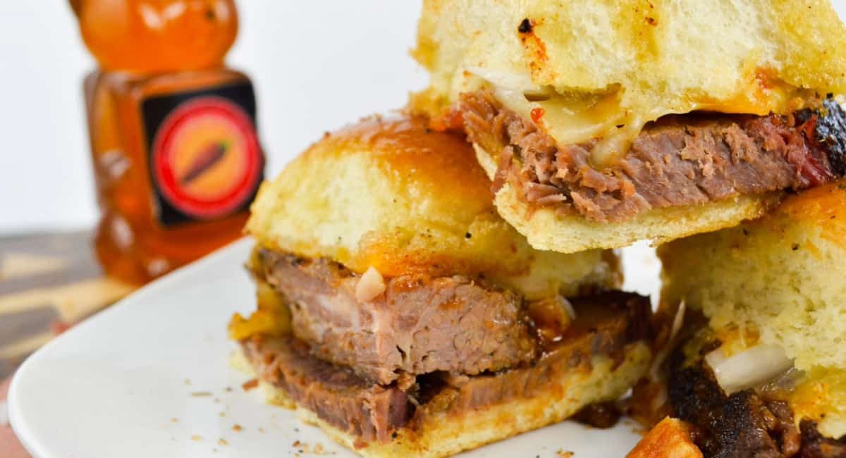 Up close image of hot honey brisket sliders.