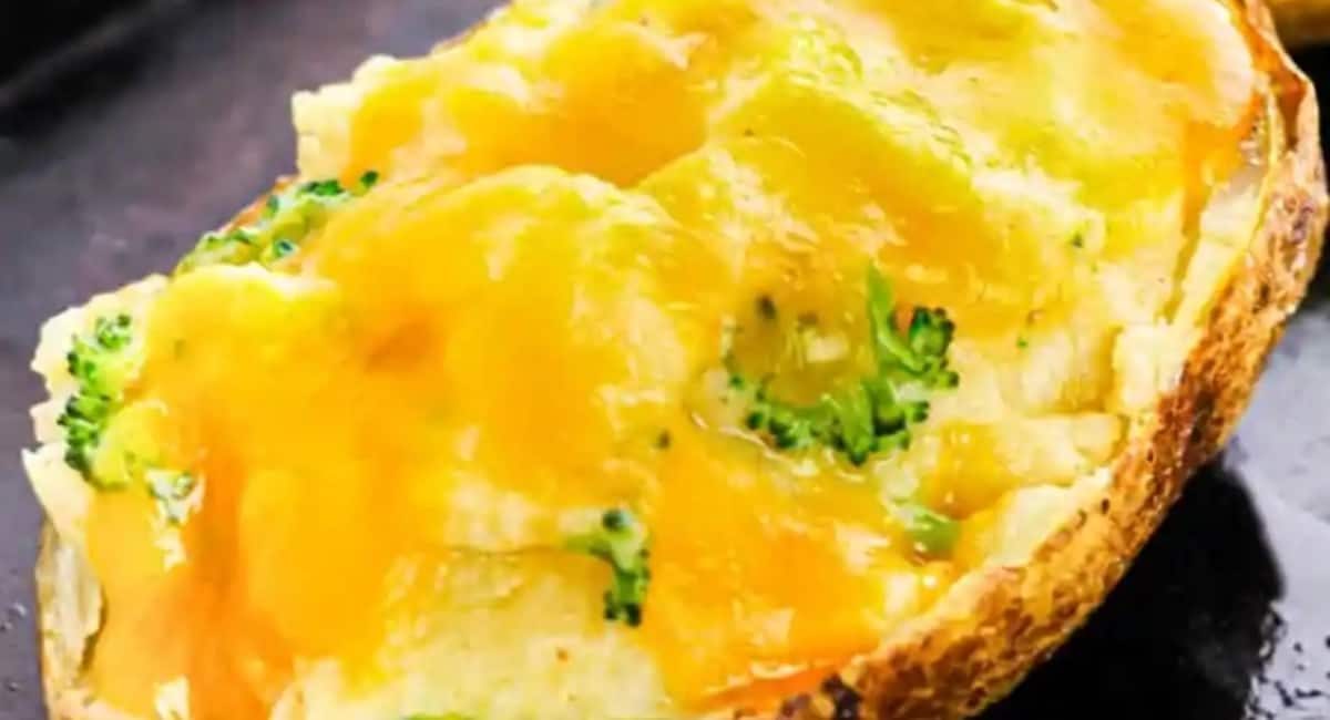 Up close image of stuffed cheddar broccoli twice baked potato.