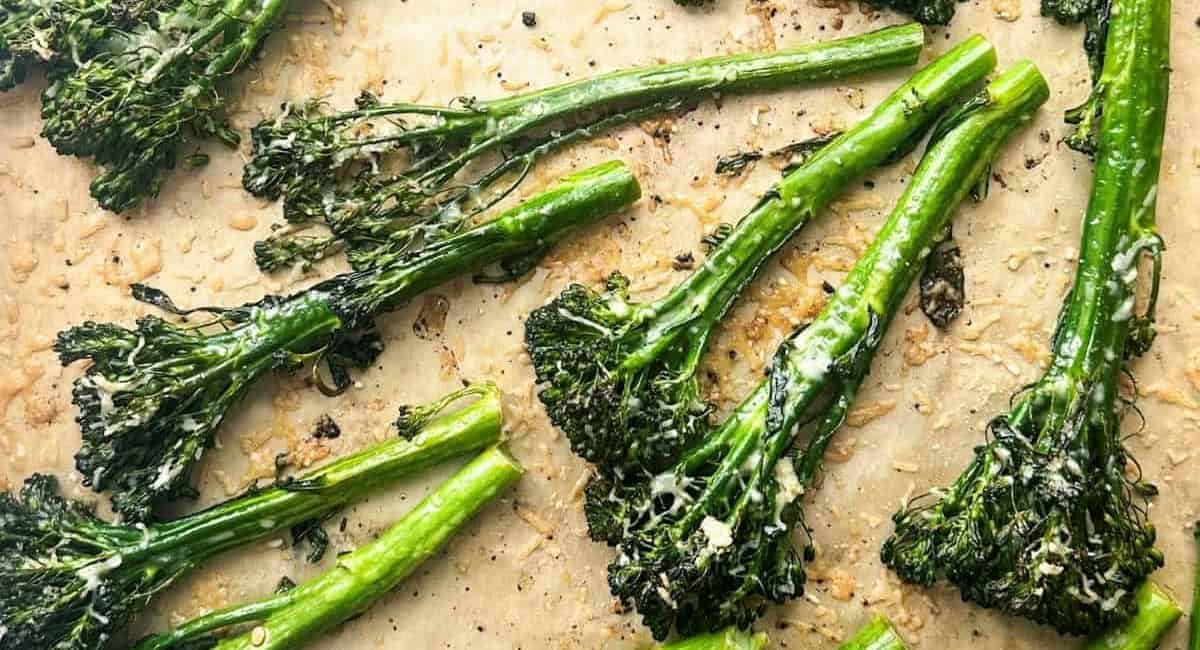 Overhead image of charred broccolini with lemon, garlic, and parmesan.