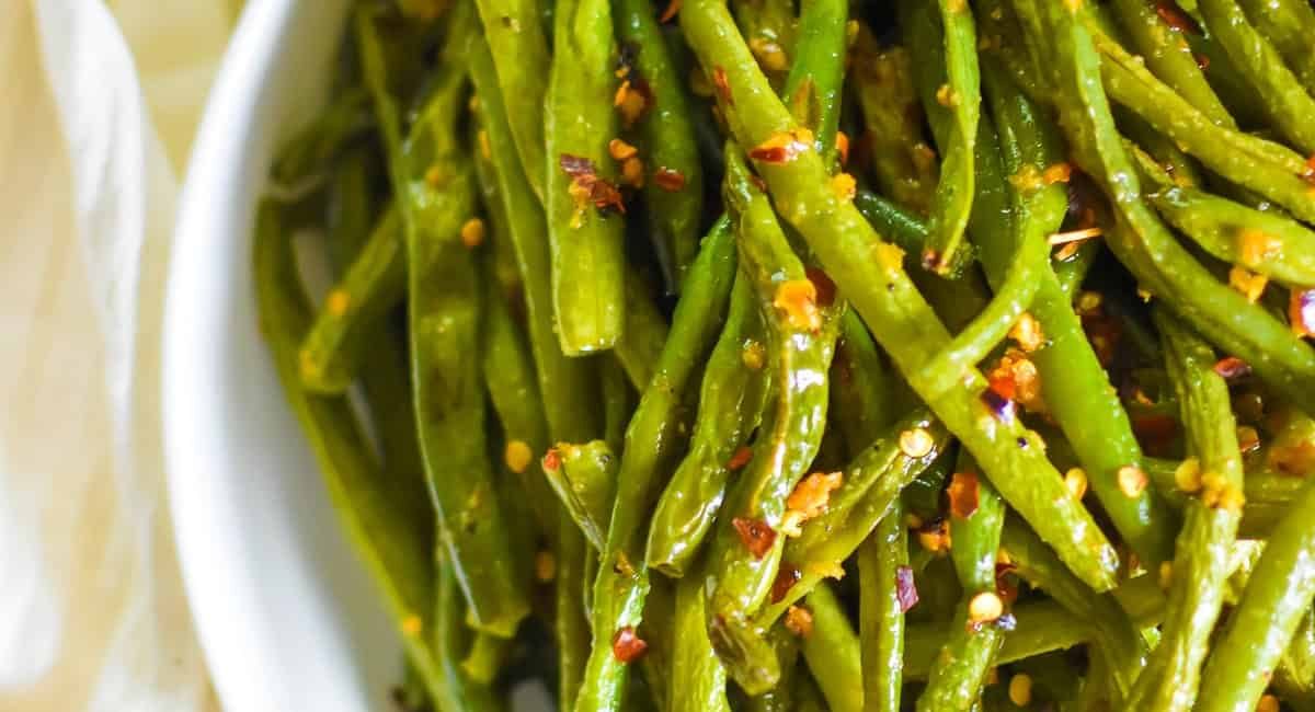 Overhead image of oven roasted green beans with garlic brown butter.