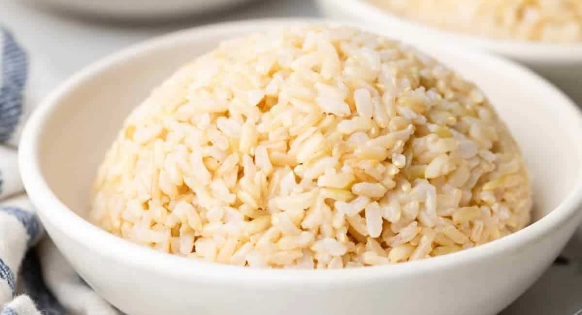 Up close image of brown jasmine rice in white bowl.