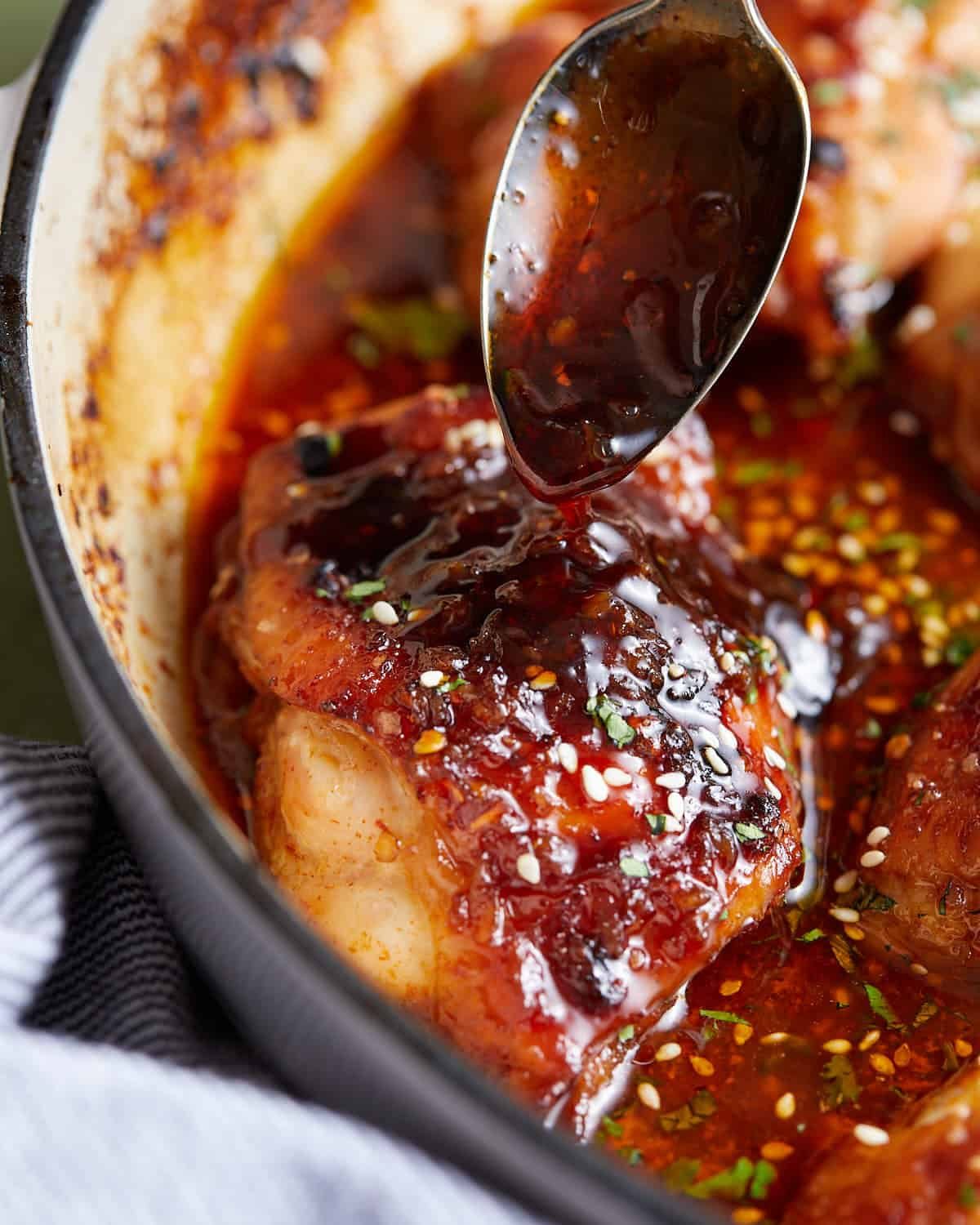 Up close image of brown sugar garlic chicken with garnish.