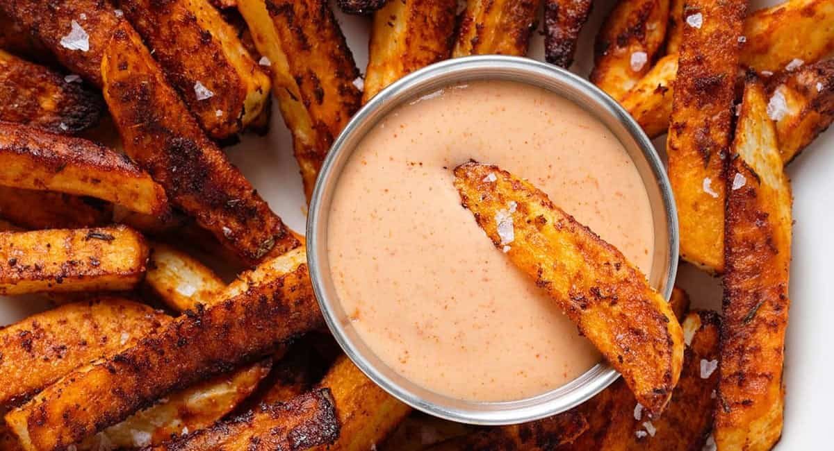 Overhead image of cajun fries with house sauce.