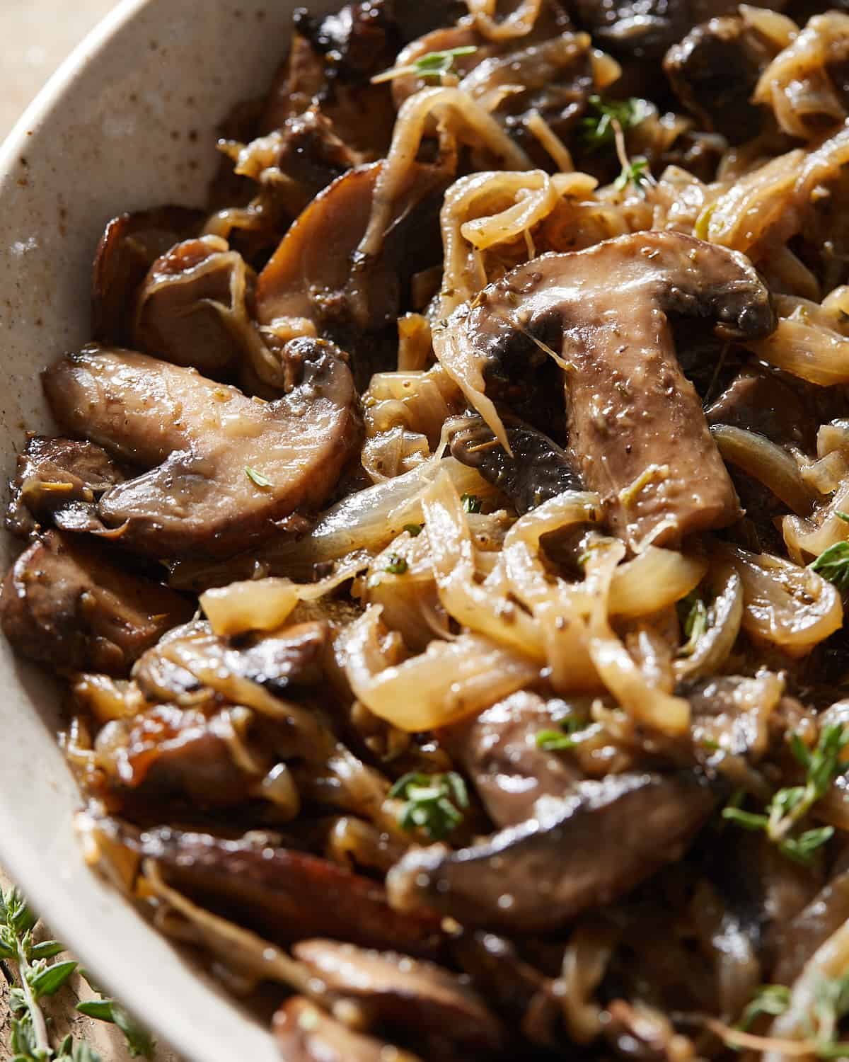 Up close image of caramelized onions and mushrooms.
