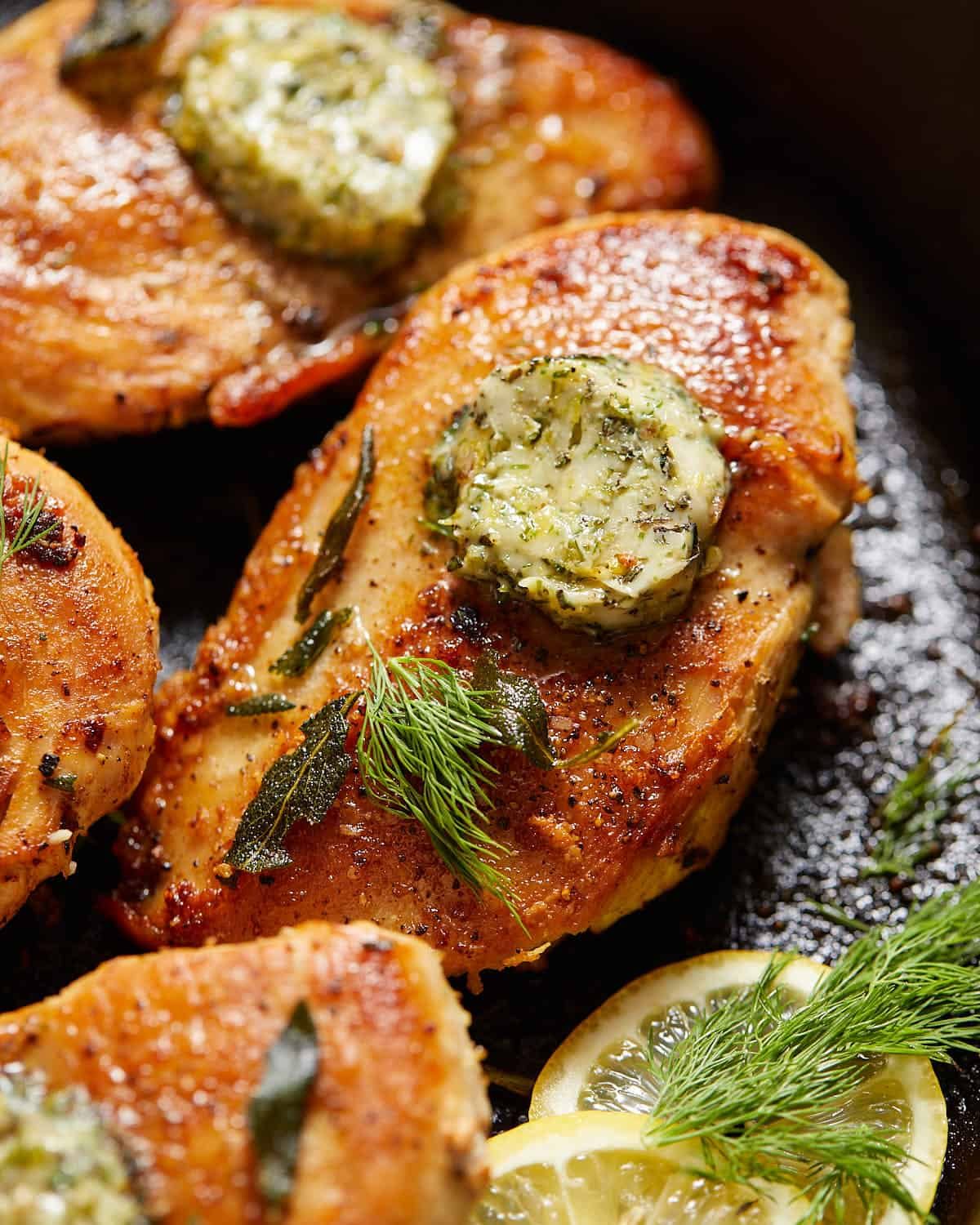 Closeup shot to show sear on cast iron chicken breast.