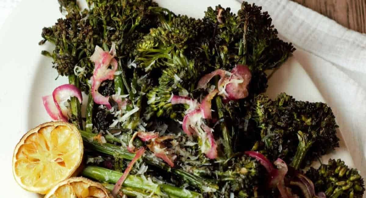 Overhead image of charred broccolini roasted with lemon, Parmesan, and garlic.
