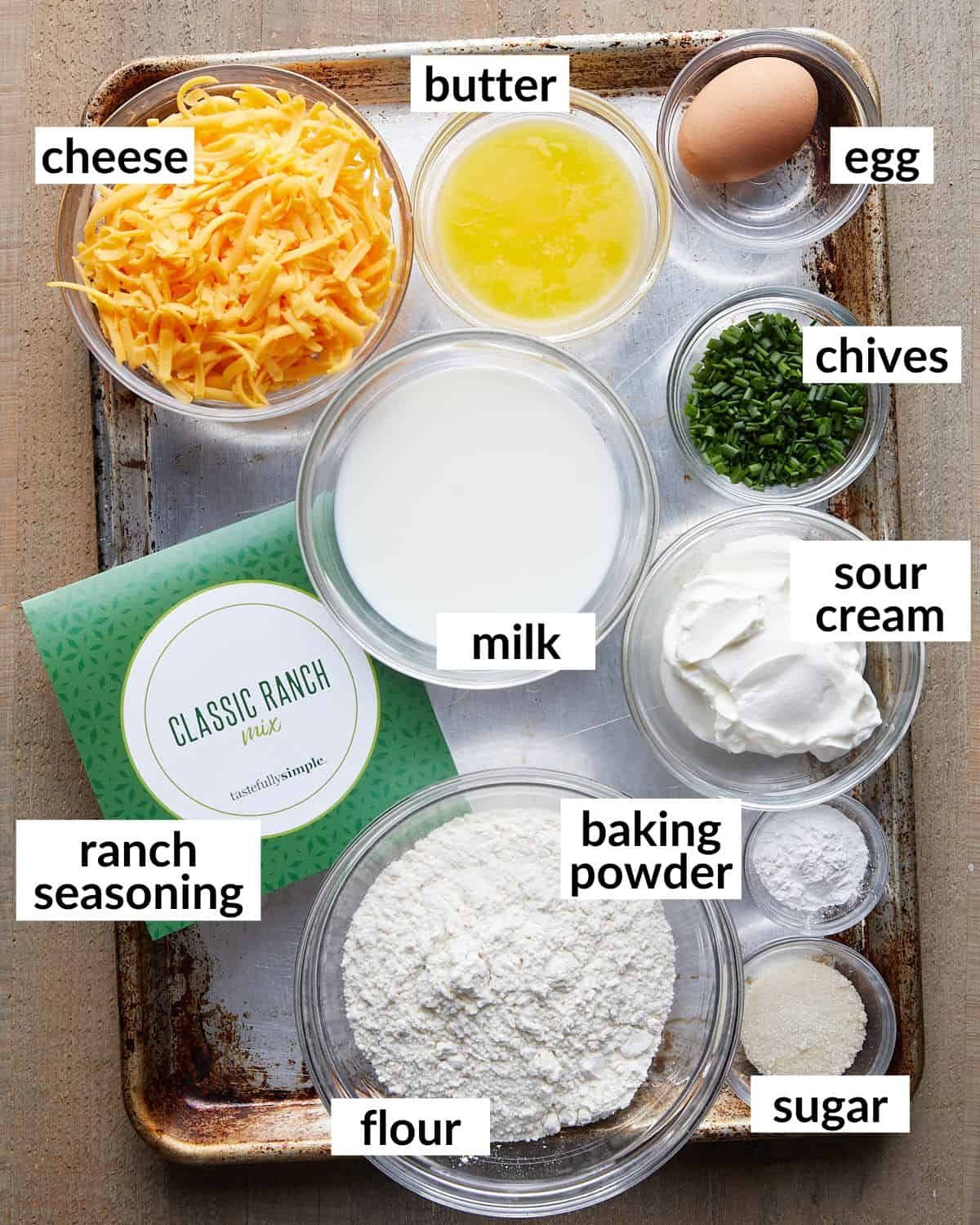 Overhead image of ingredients needed to make cheddar chive muffins.
