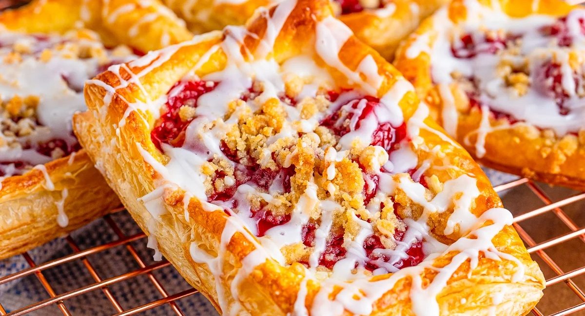 Up close image of cherry danish with cream cheese.