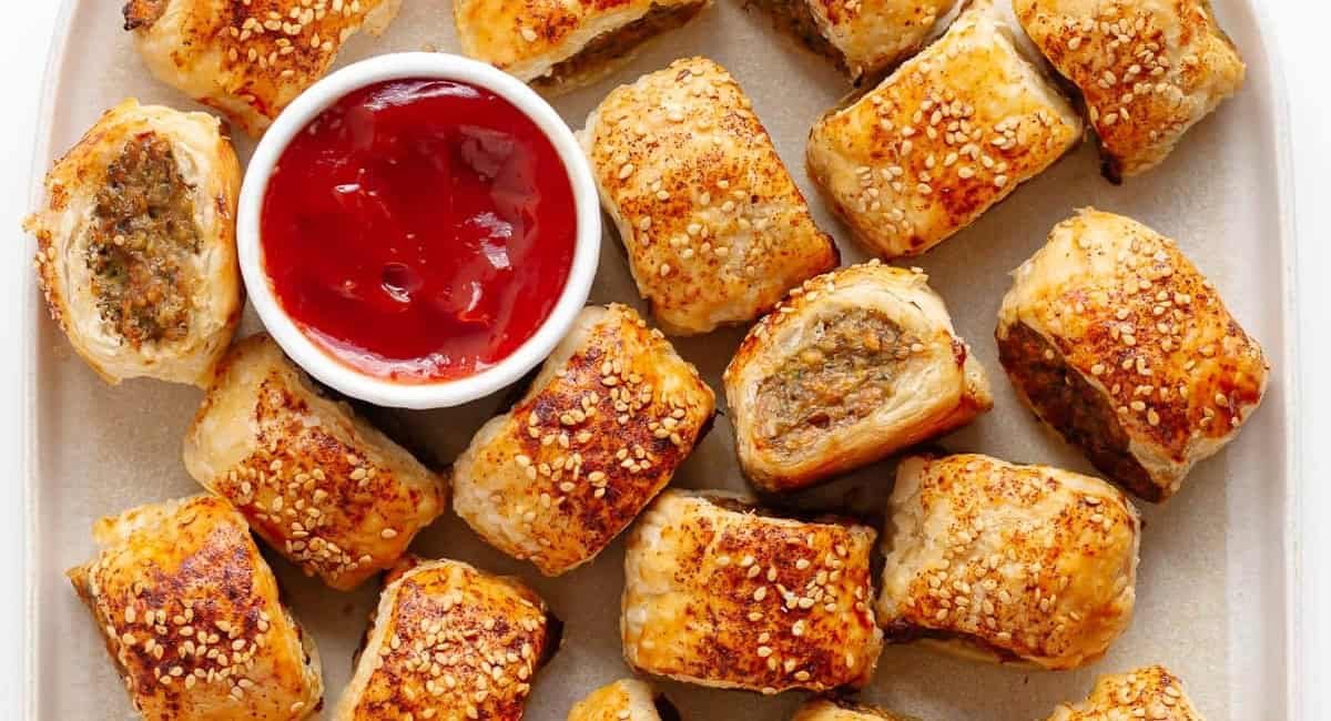 Overhead image of chicken sausage rolls made with puff pastry.