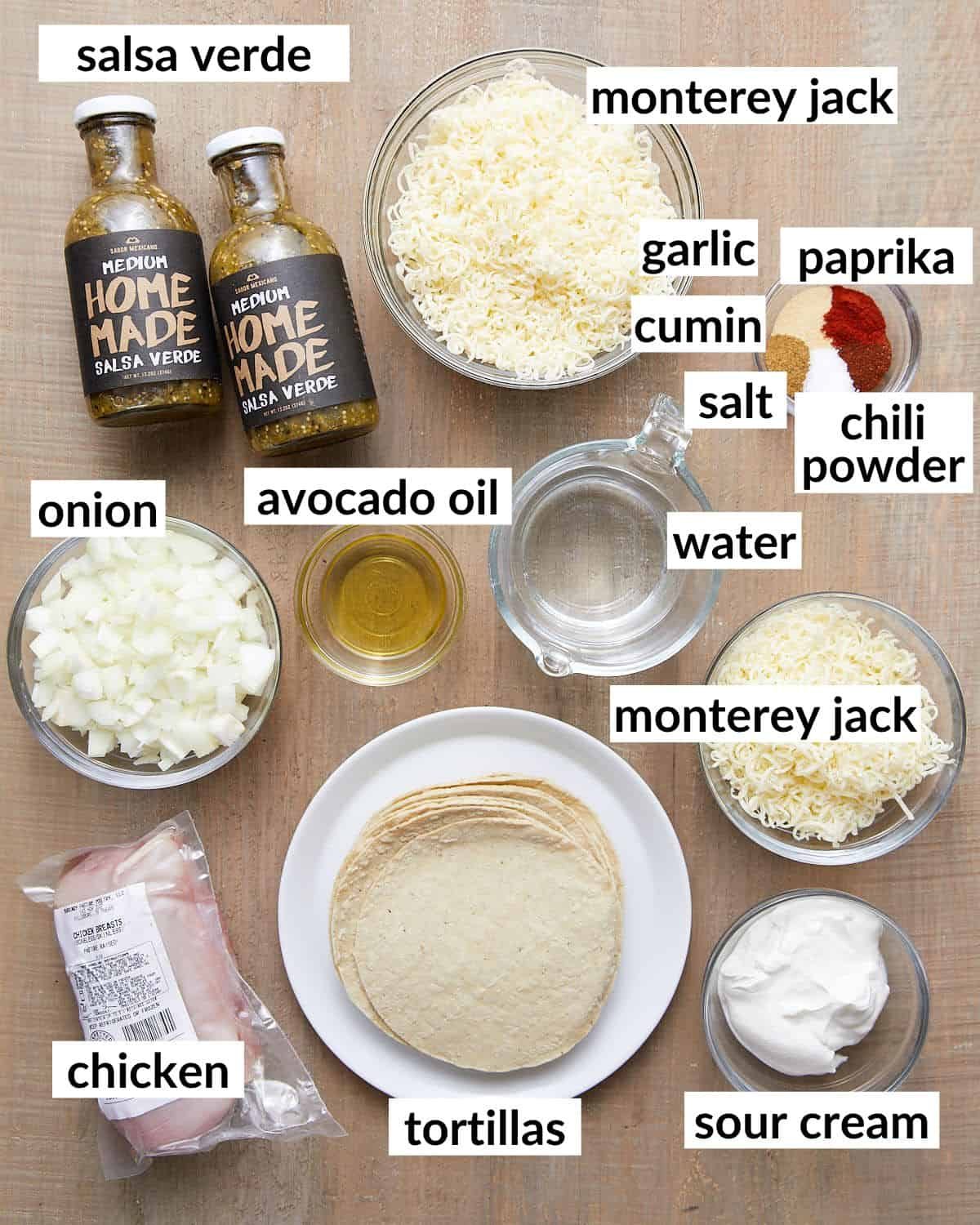 Overhead image of ingredients needed to make chicken enchiladas with green sauce.