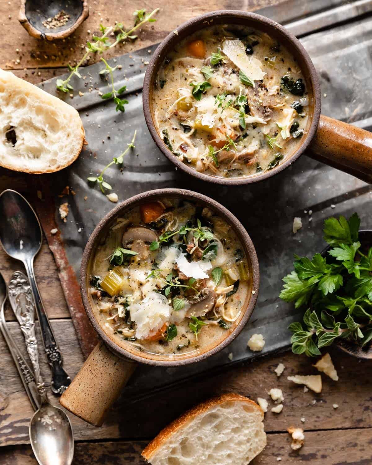 overhead of 2 soup bowls and bread