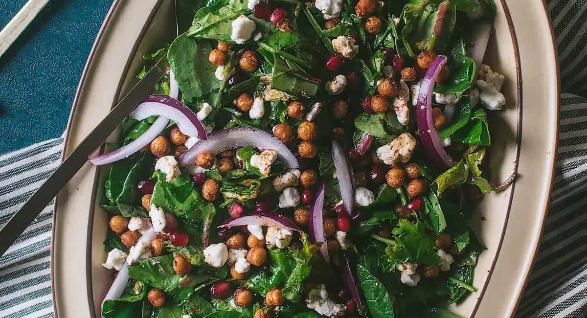 Overhead image of chickpea pomegranate goat cheese salad.