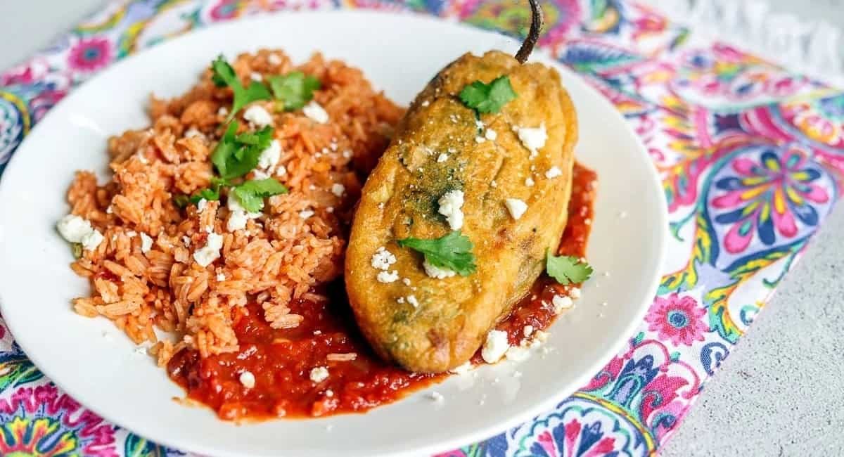 Overhead image of chile relleno with garnish.